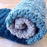 modern handmade crochet baby blanket in blue and grey color block design