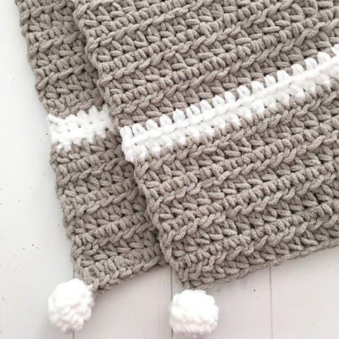 new baby gift, grey and white chunky crochet handmade blanket with pom poms from Design by aw