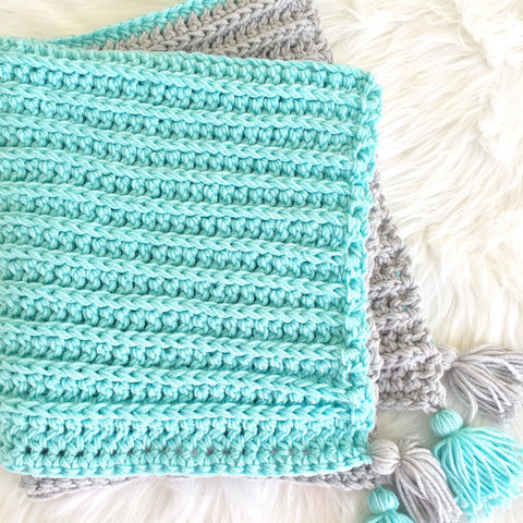 crochet handmade baby blanket in aqua and grey with corner tassels from Design by AW